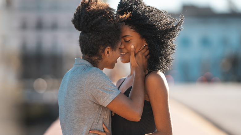 Couple kissing outside