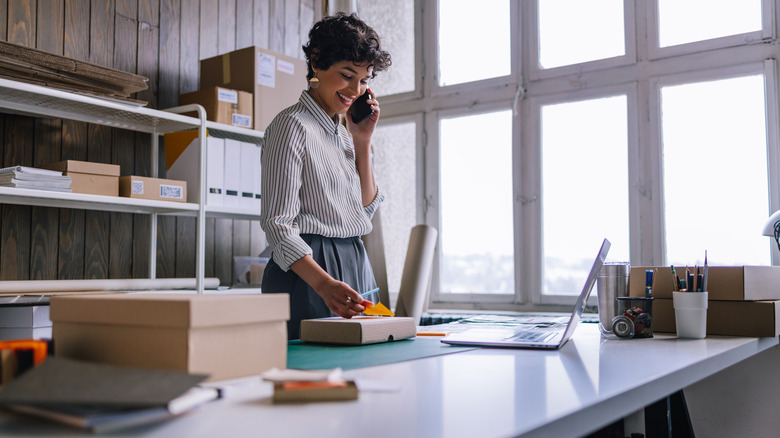 happy working woman on phone