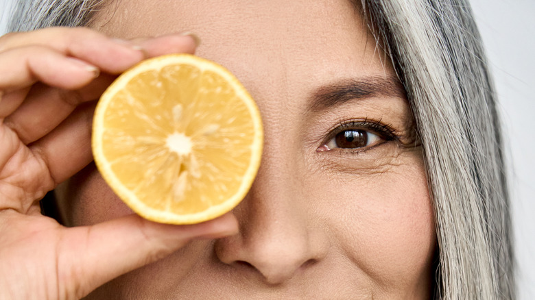 Woman holding a lemon