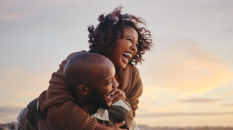 couple laughing hugging
