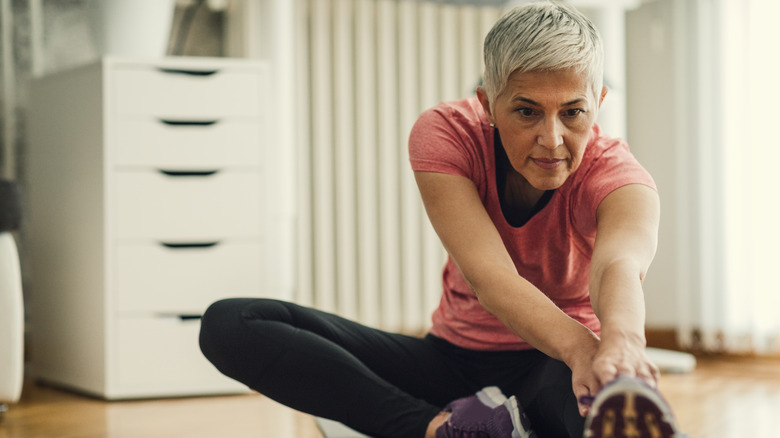 Woman stretching her leg