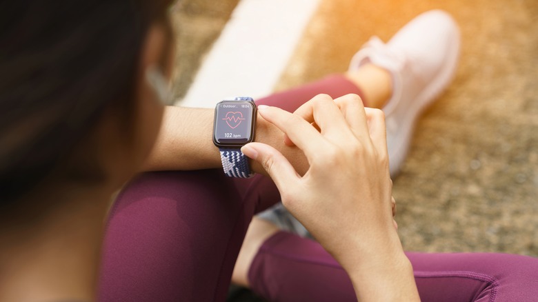 Woman looking at her smart watch