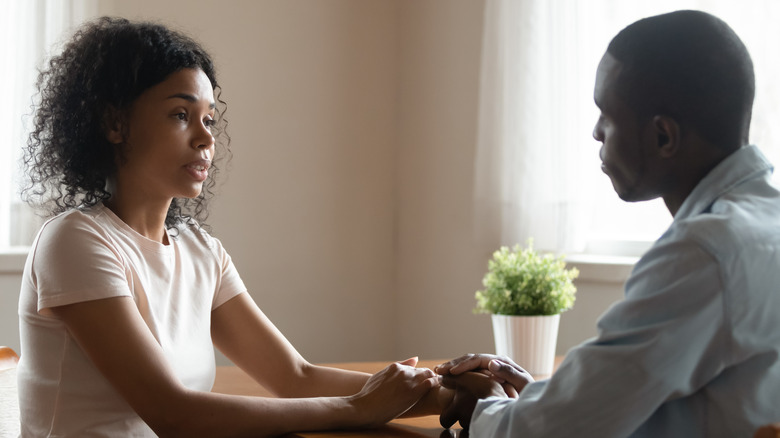 Woman and man having serious conversation