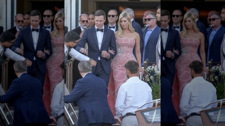 Ivanka Trump wearing a pink and silver gown while walking with her husband Jared Kushner.