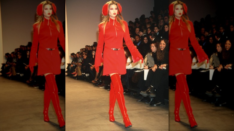 Ivanka Trump wearing an all-red outfit with thigh-high boots and ear muffs