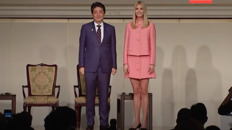 Ivanka Trump speaking in Tokyo while wearing pink miniskirt