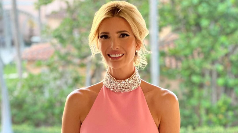 Ivanka Trump smiling with her hair up and a diamond collar around her neck