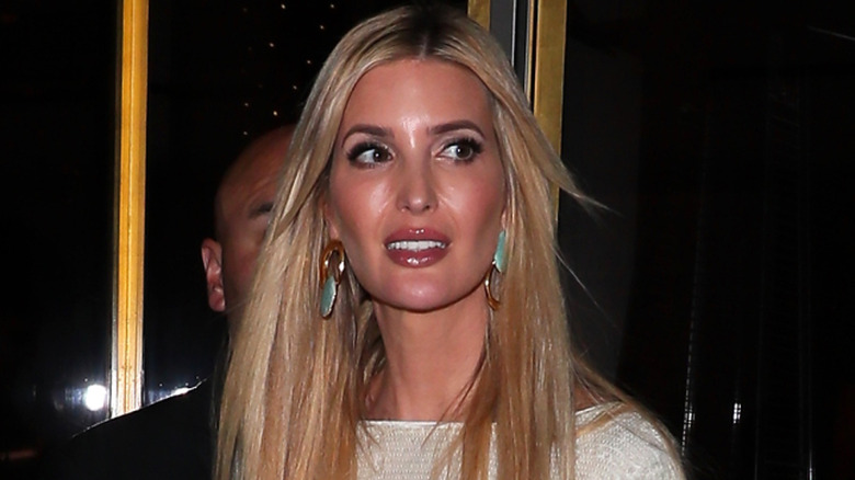 Ivanka Trump wearing white sequins and large turquoise and tortoiseshell earrings