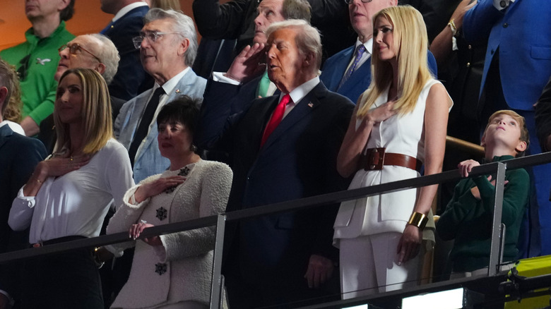 Ivanka Trump standing next to her father, President Donald Trump, at the 2025 Super Bowl at Ceasars Superdome in New Orleans