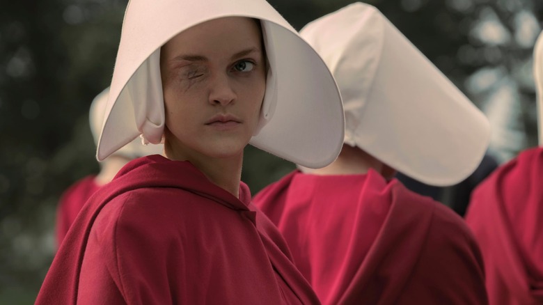 Madeline Brewer wearing a red robe with a white head covering as Janine in Hulu's "The Handmaid's Tale"