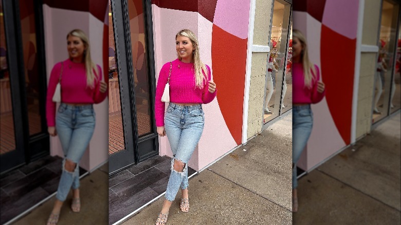 Woman wearing acid-wash jeans, heels