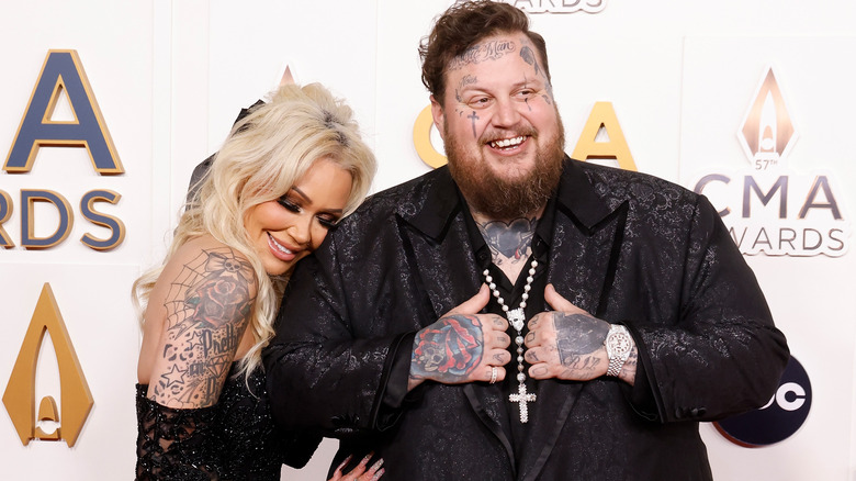 Jelly Roll and Bunnie Xo cuddling on the red carpet