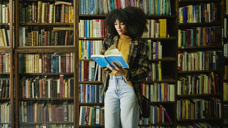 Woman reading in a bookstore