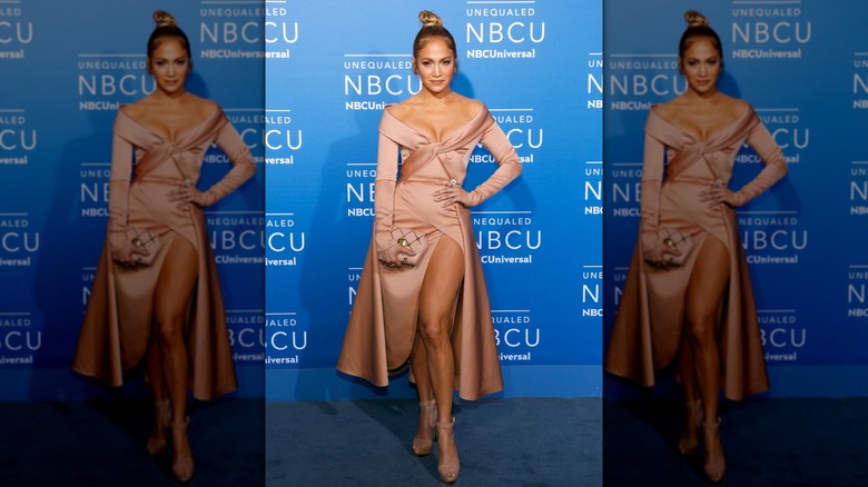 Jennifer Lopez posing in a blush dress by Elie Saab in 2017