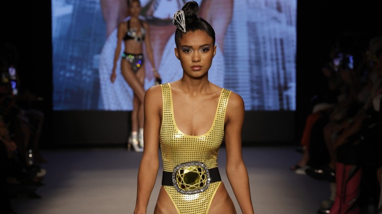model wearing swimsuit on runway