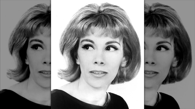 Joan Rivers looking off camera with a short bob with micro bangs.