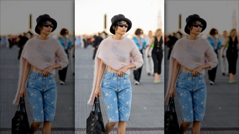 Woman with knit top, printed jorts