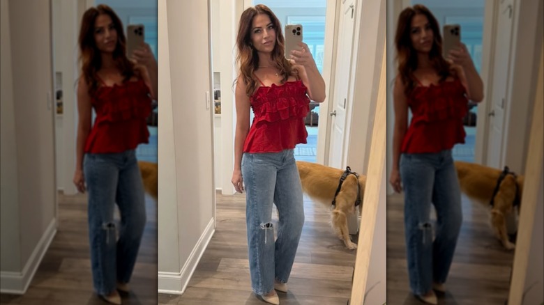 Katherine Hough takes a photo of herself in a floor length mirror