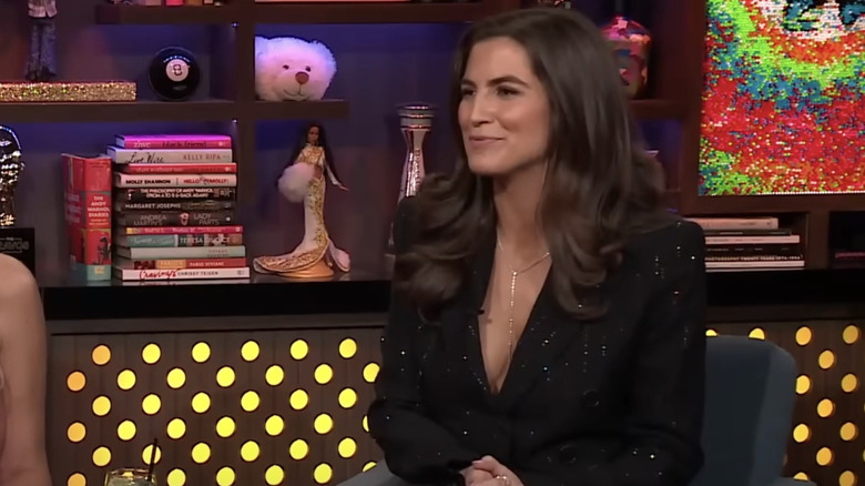 Kaitlan Collins on Watch What Happens Live with a sparkly black suit