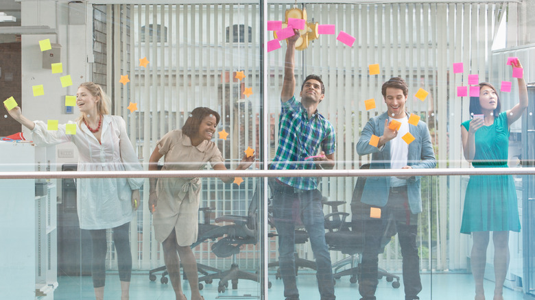 coworkers using kanban board