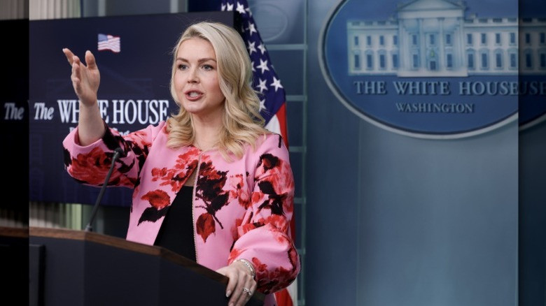 Karoline Leavitt speaks to a reporter at a press conference