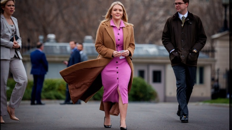 Karoline Leavitt walks outside the White House