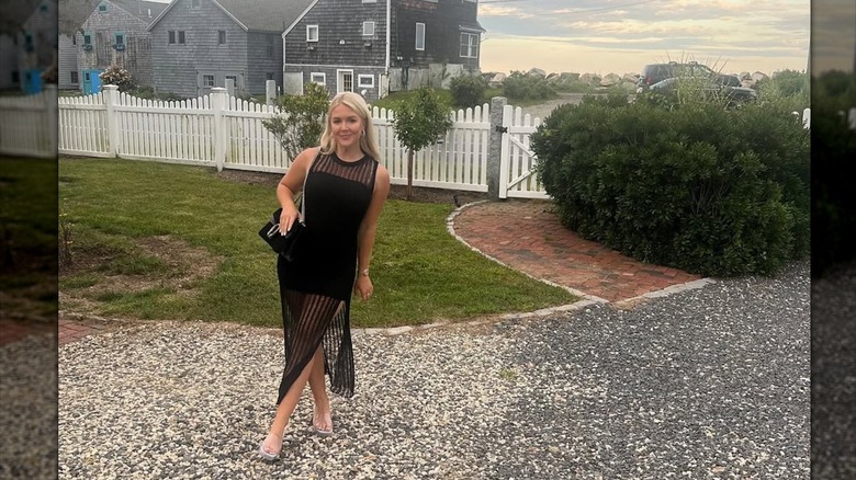 Karoline Leavitt posing in a black sheer dress