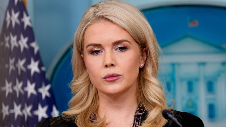 Karoline Leavitt wearing pink lipstick with dark brows