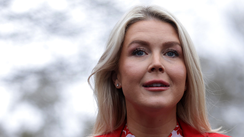 Karoline Leavitt stands at a press conference outside the White House