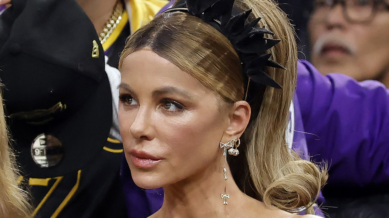 Kate Beckinsale posing with a black headband on
