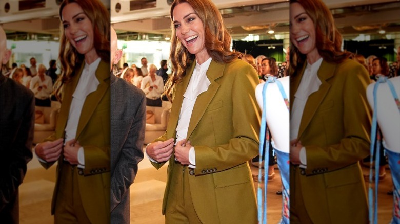 Princess Catherine smiles as she makes an appearance in an olive suit