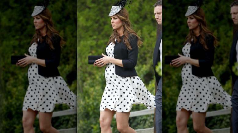 A pregnant Kate Middleton arrives at a wedding