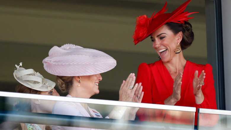 Kate Middleton clapping in red dress