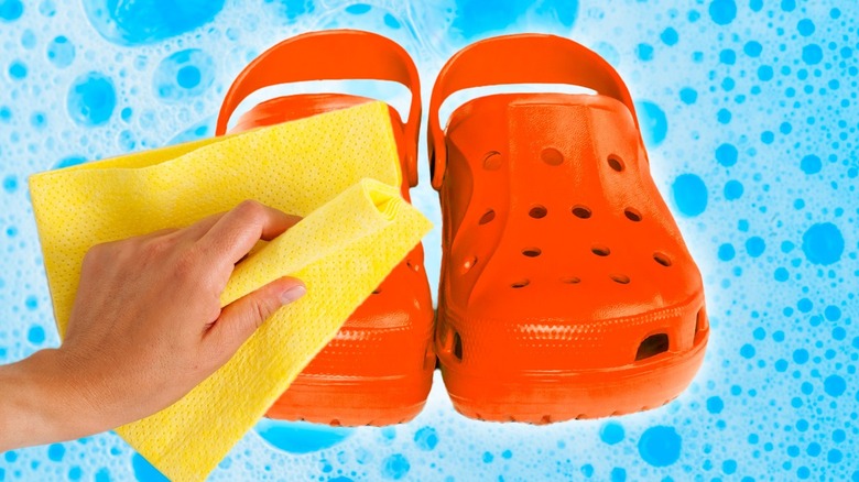 Cleaning crocs with yellow cloth