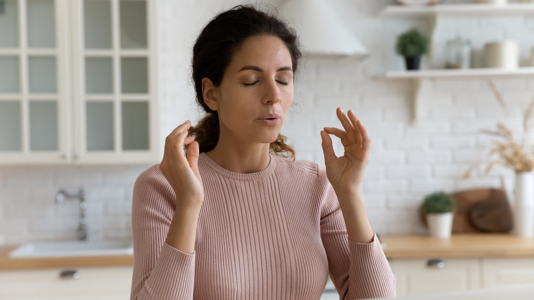 Woman deep breathing for patience