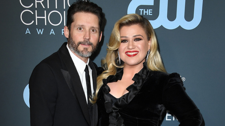 Kelly Clarkson and Brandon Blackstock wearing black