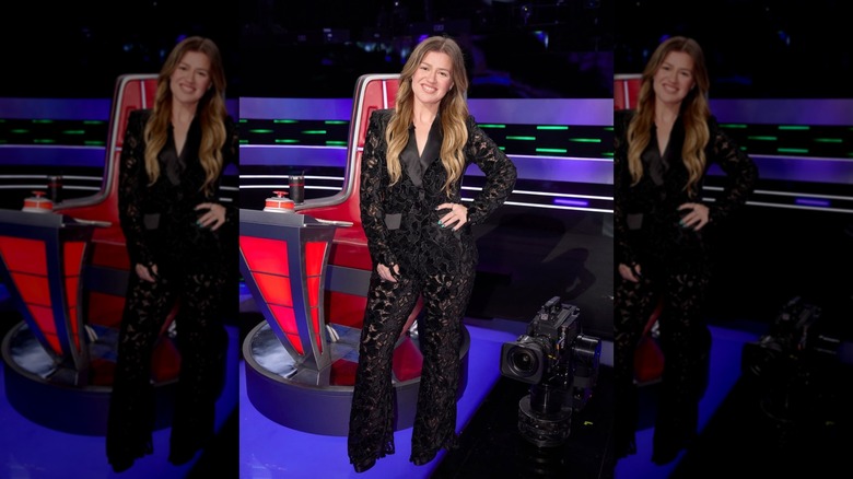 Kelly Clarkson wearing a black lace suite on "The Voice"