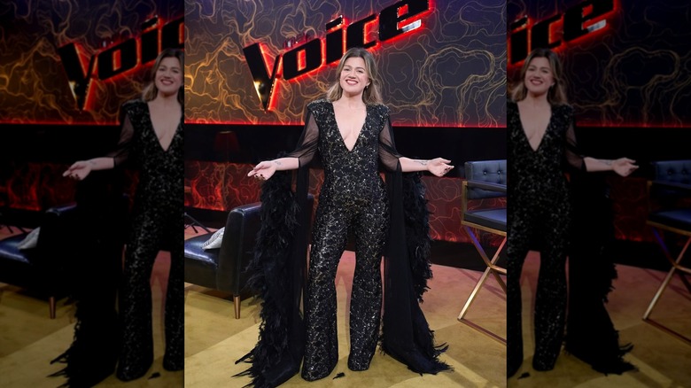 Kelly Clarkson wearing a black jumpsuit on "The Voice"