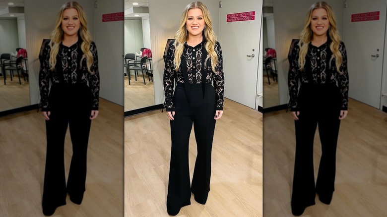 Kelly Clarkson in a black lace top and pants