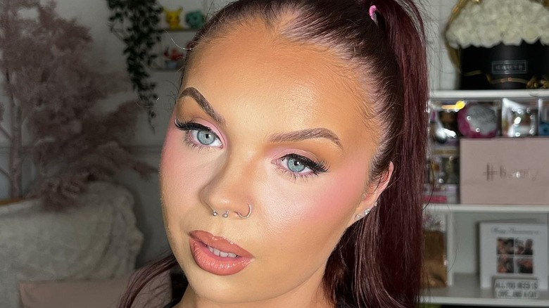 Woman wearing bright eye concealer
