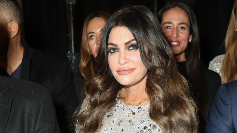 Kimberly Guilfoyle with heavy makeup looking into the camera