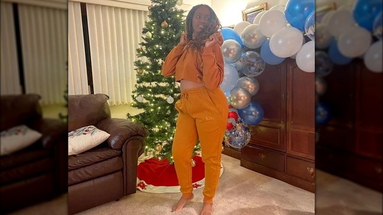 Woman wearing KIN Apparel jogging suit