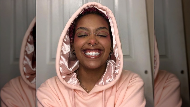 Woman wearing KIN Apparel hoodie