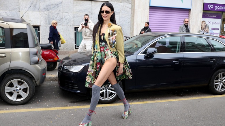 woman wearing knit knee-high socks