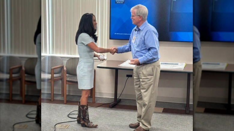 Lauren Boebert shakes hands while visiting a hospital