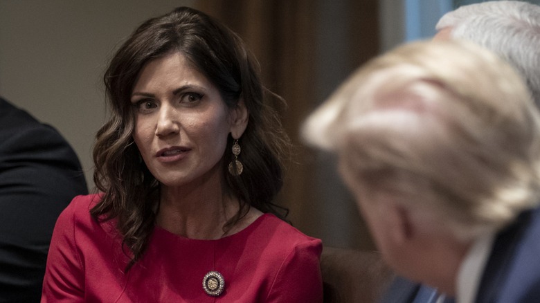 Kristi Noem talking to Donald Trump in 2019.