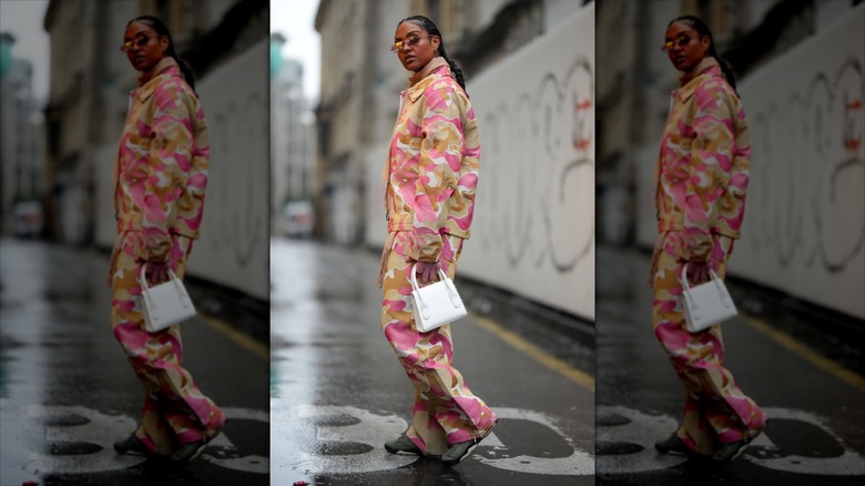 Kristi Noem wearing combat leggings during a visit to Chile