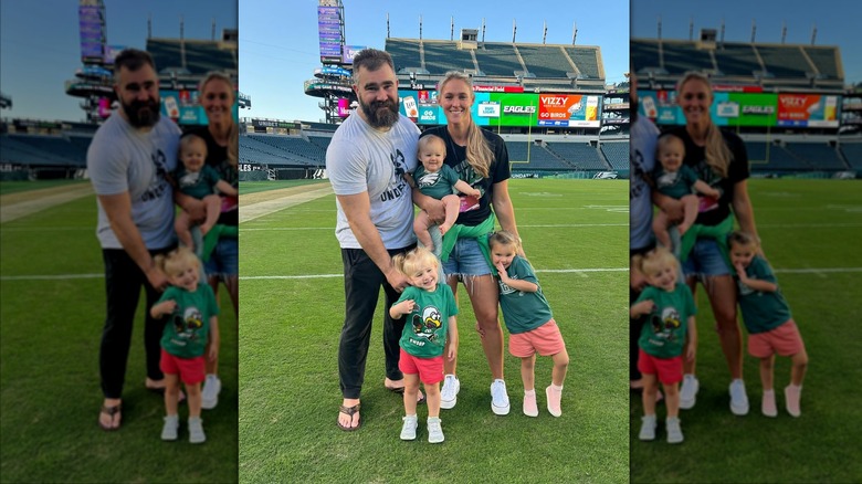 Jason and Kylie Kelce smiling with their kids