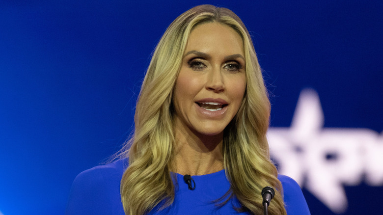 Lara Trump speaking in a blue dress at a podium