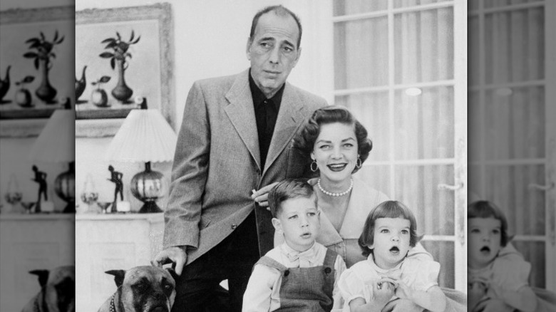 Humphrey Bogart and Lauren Bacall pose with their young children
